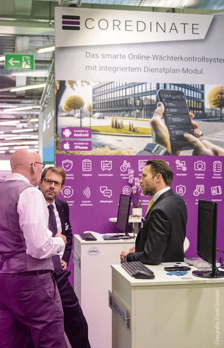 SicherheitsExpo Munich Michael and Sebastian Kulig in conversation with an interested visitor (Photo: Frank Schroth)