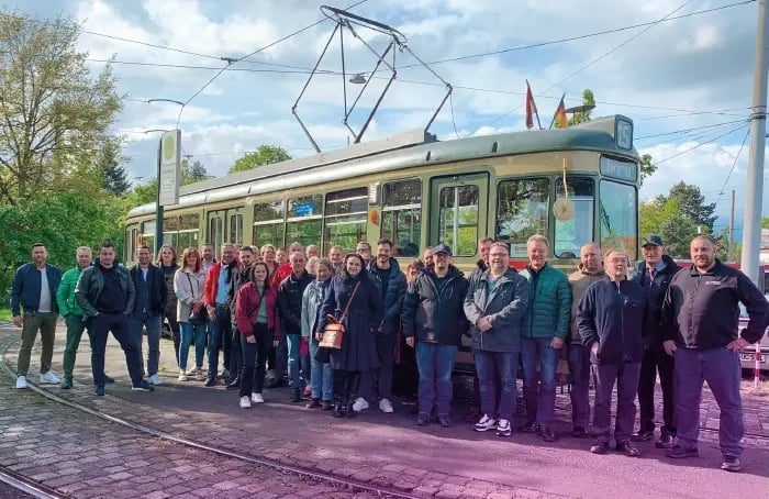 Group photo in front of a historic tram in Nuremberg