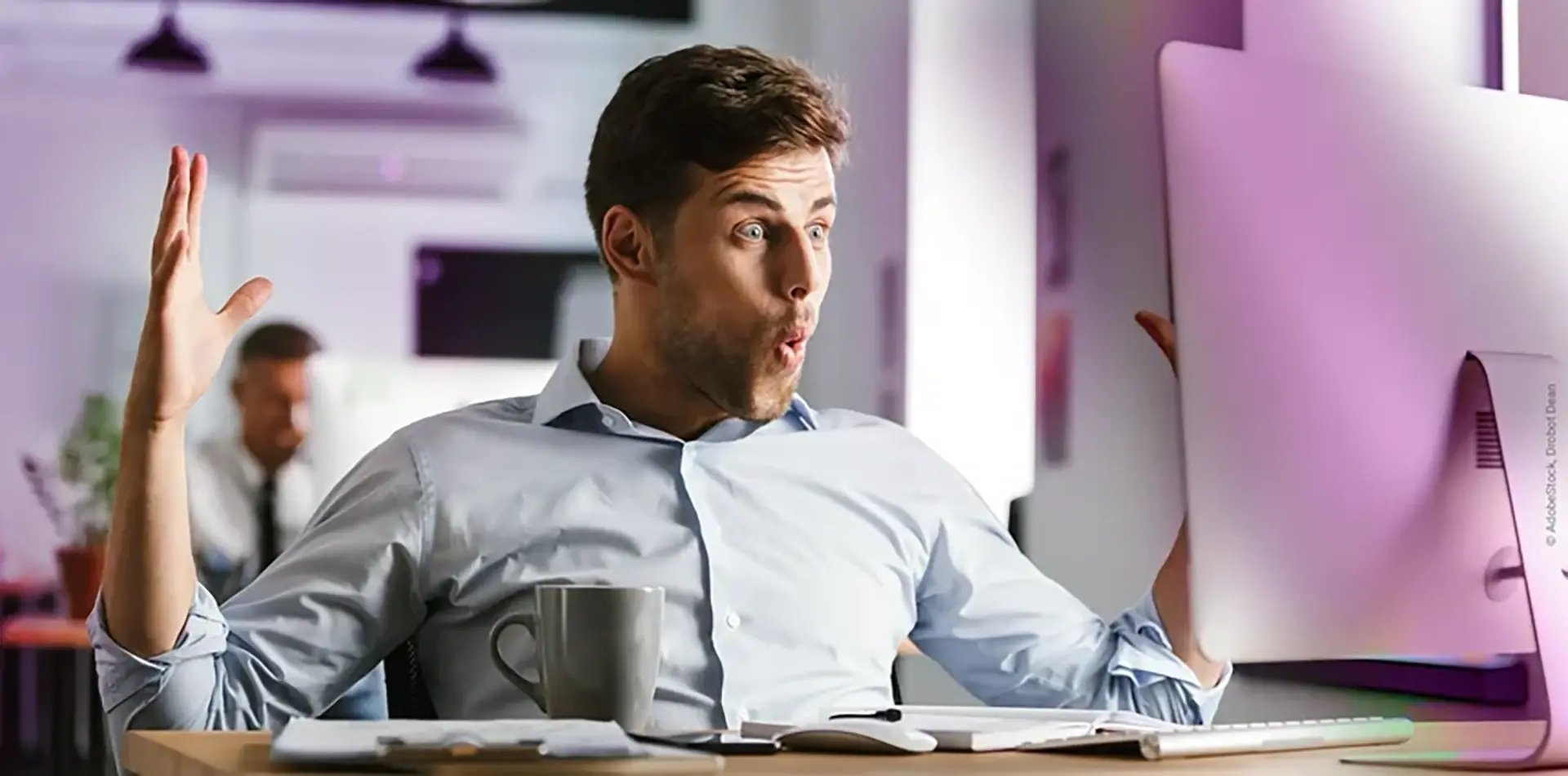 Business_man_computer_surprised_AdobeStock_220788728_Drobot_Dean-1