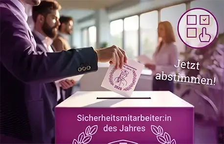 A man casts his ballot for Sicherheitsmitarbeiter des Jahres in the ballot box.